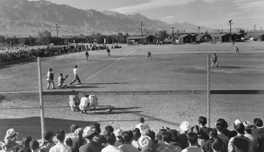 Incarcerees playing baseball in Manzanar Concentration Camp